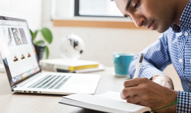 Business professional taking notes